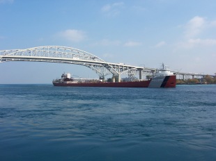 Ship downbound under the Blue Water Bridge in Port Huron
